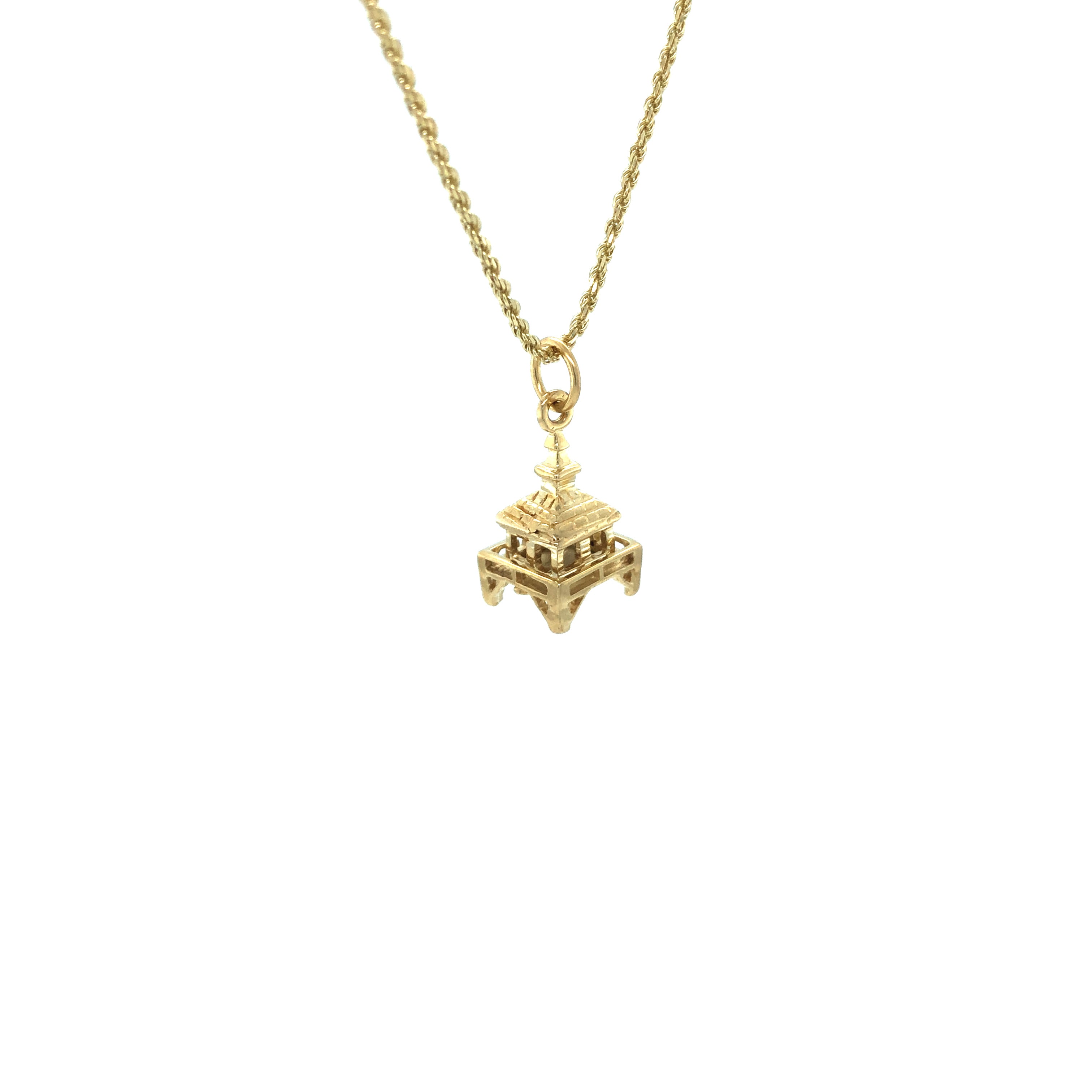 gold boca grande pendant on a gold chain